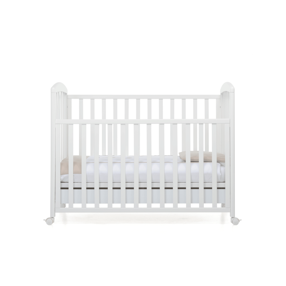 Babyfly baby cot by Foppapedretti designed with one side adjustable into two heights and the baby cot can be opened at the side and folded up under the cot turned into a sofa.