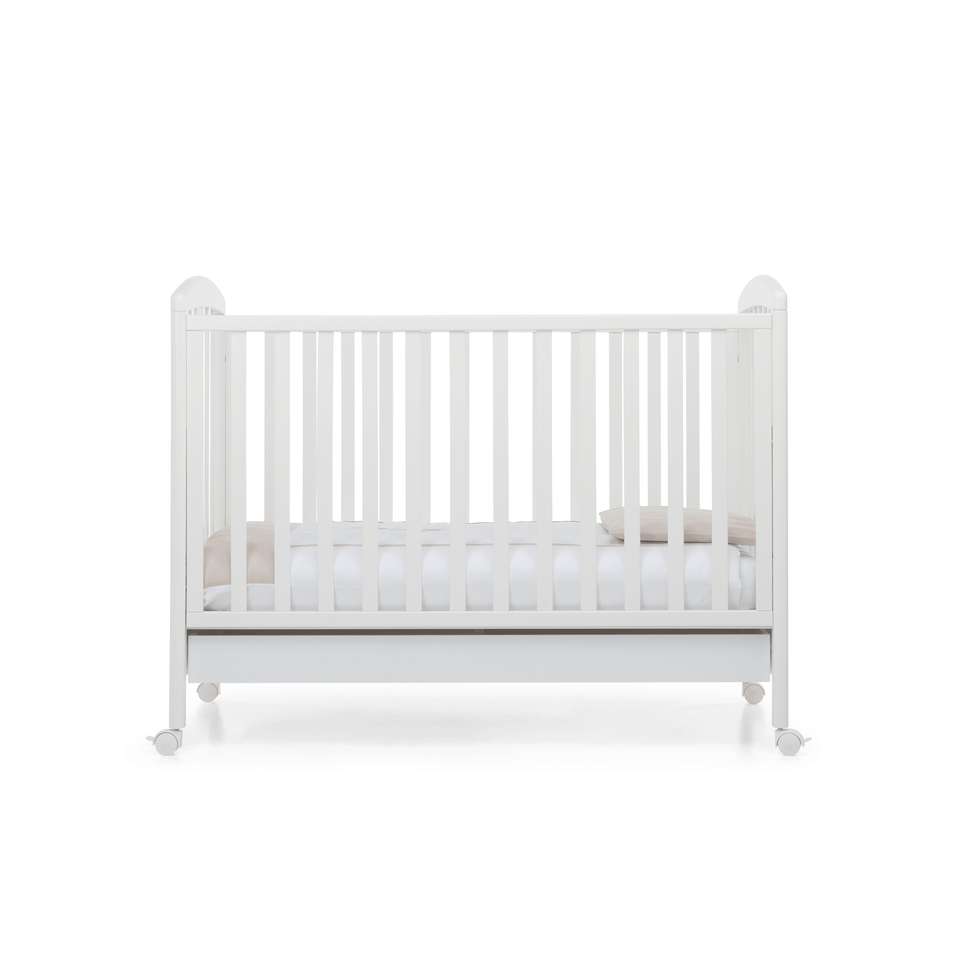 Babyfly baby cot by Foppapedretti designed with one side adjustable into two heights and the baby cot can be opened at the side and folded up under the cot turned into a sofa.