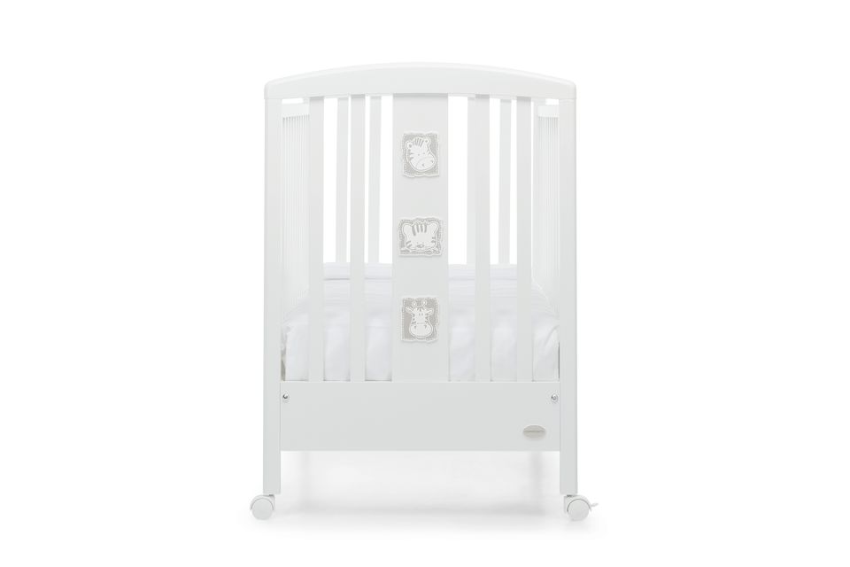Babyzoo baby cot by Foppapedretti designed with one side adjustable into two heights and the baby cot can be opened at the side and folded up under the cot turned into a sofa.